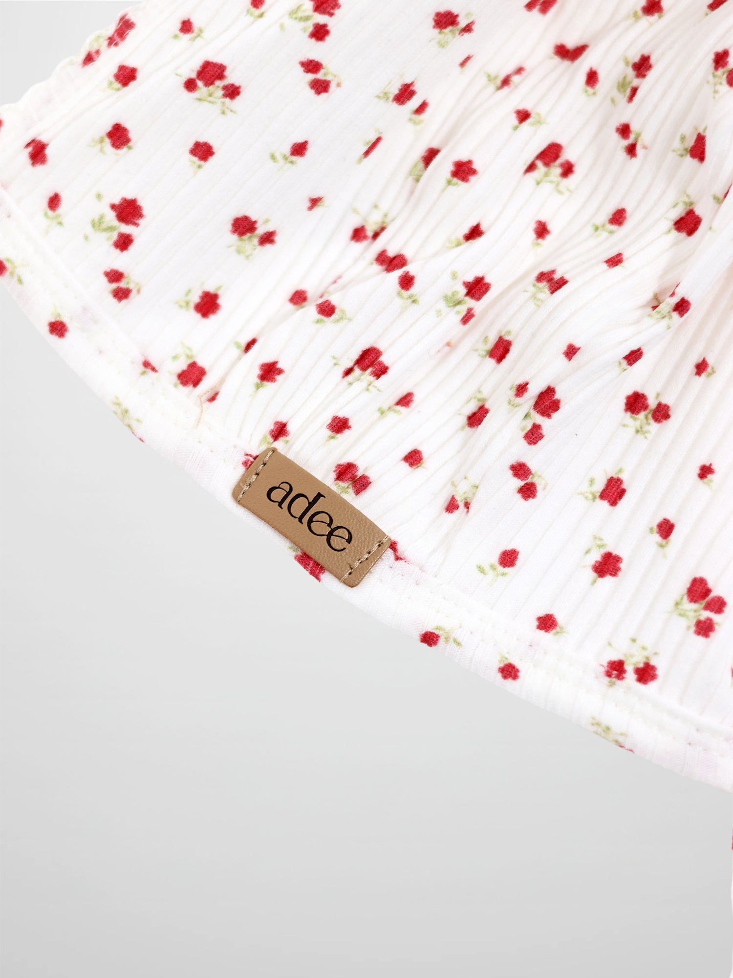 Red Flower Bonnet for girls by Adee; white pleated fabric with tiny red flowers