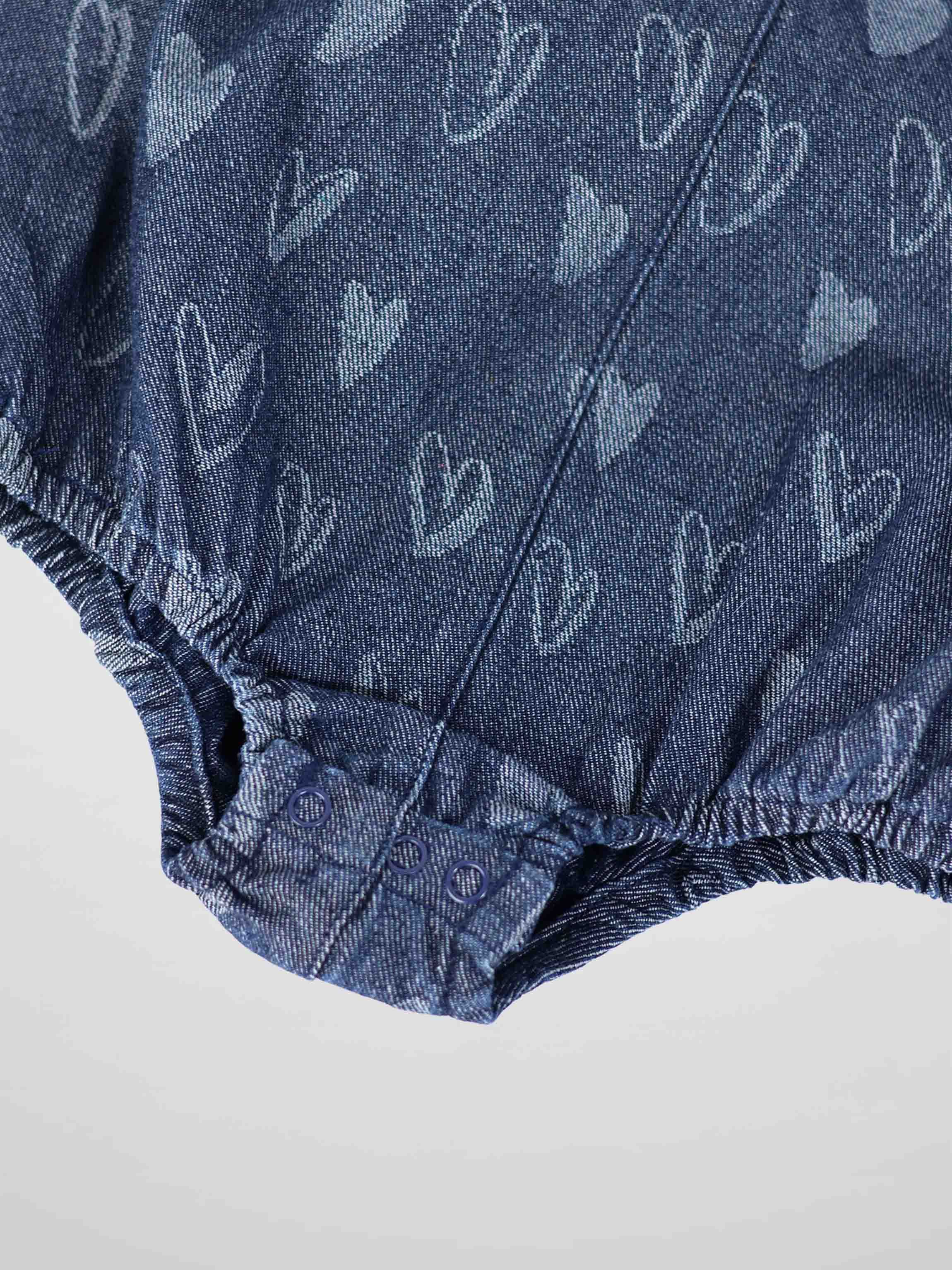 Denim Heart Romper for girls by Adee; blue denim fabric with heart print and snap closures.