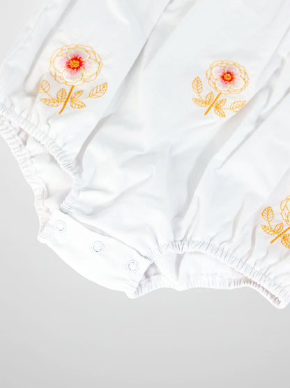 Embroidered Flower Romper by Adee, white girls dressy romper with orange floral embroidery and elastic cuffs.