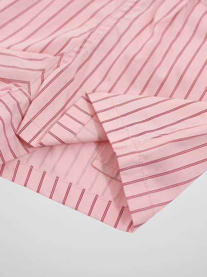 Striped pink cotton shorts for girls by Adee; soft pink fabric with dark red stripes and visible stitched hems.