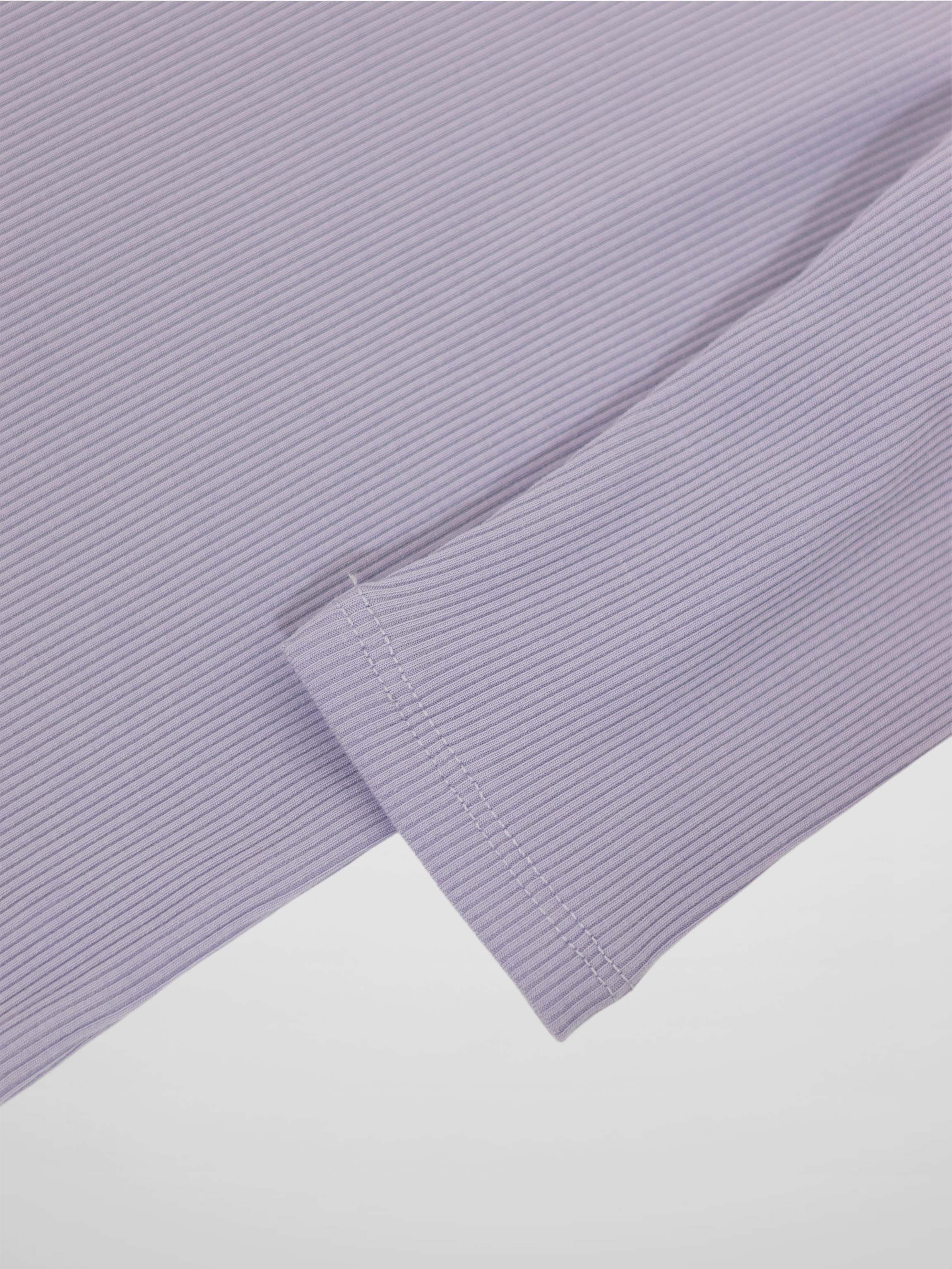Lavender 3/4 sleeve T-shirt fabric close-up with cuff stitching.