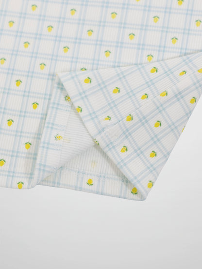 Lemon Window Pajamas fabric close-up: white base with light blue grid plaid and tiny yellow lemons.