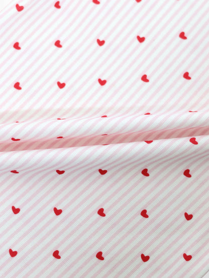 Pink Heart Hat fabric pattern with pink diagonal stripes and red hearts by Adee