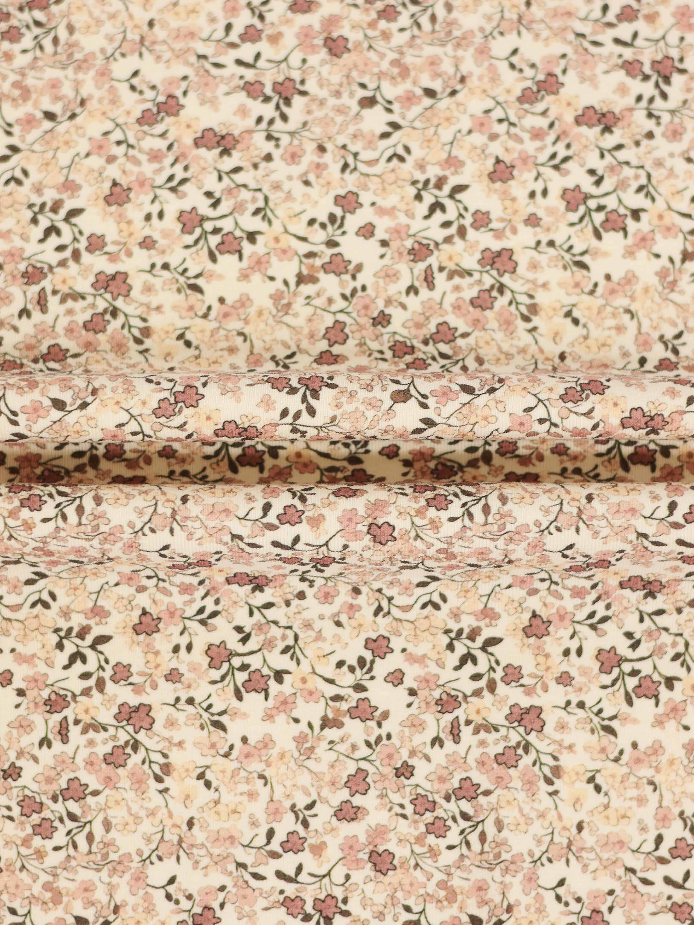 Purple Flower Hat fabric with an all-over pink floral print on a cream background