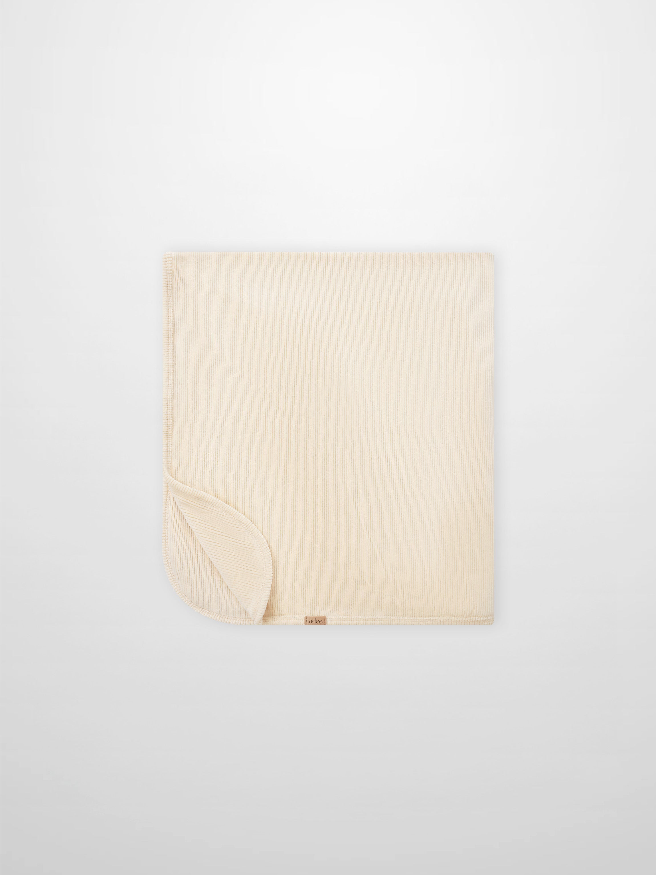 Embroidered Anchor Blanket by Adee; beige ribbed boys swaddle blanket with anchor motif.
