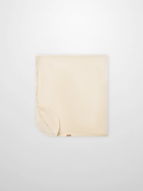 Embroidered Anchor Blanket by Adee; beige ribbed boys swaddle blanket with anchor motif.