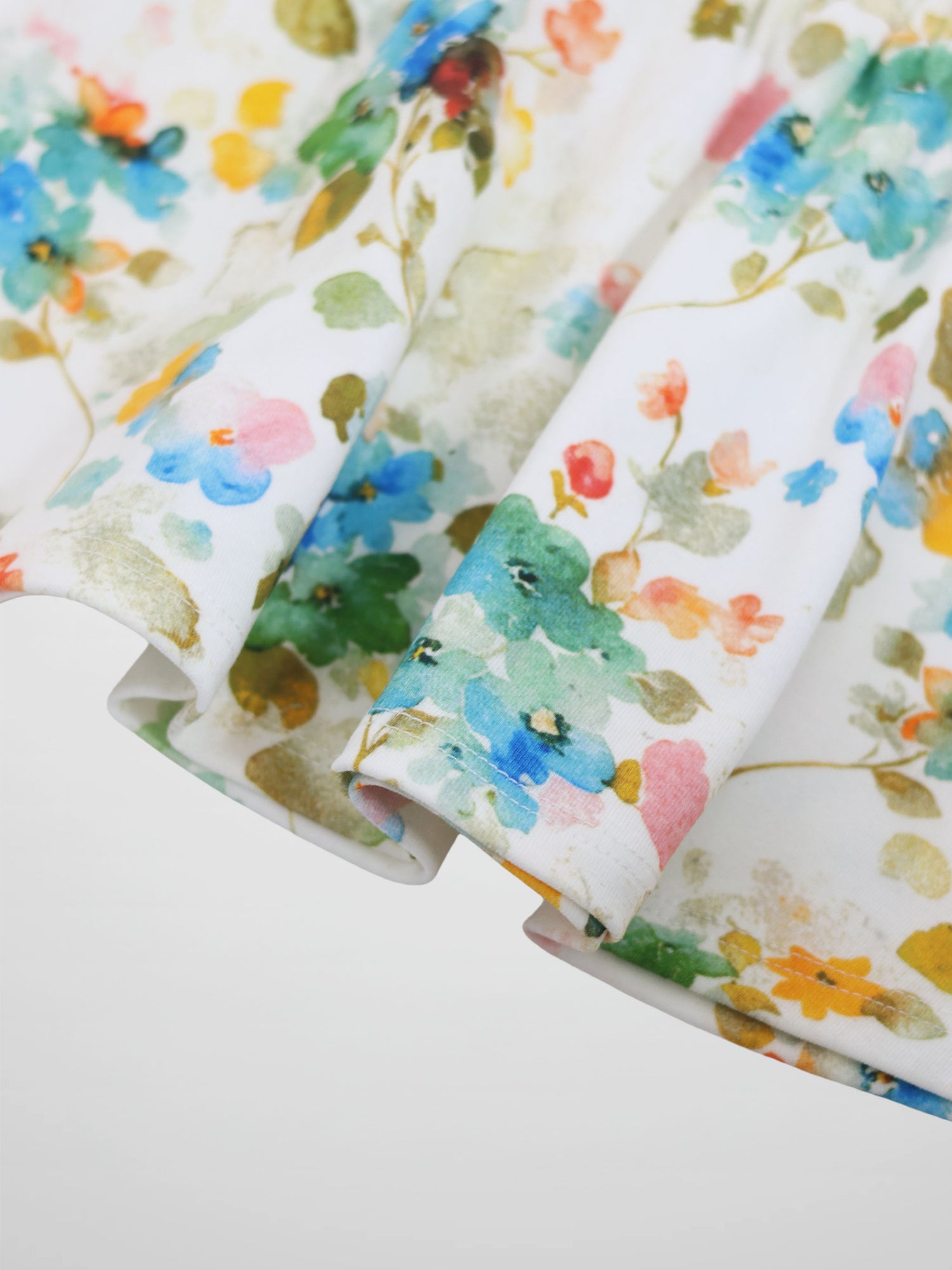 Pastel Flower Skirt for girls by Adee featuring a vibrant floral print on white fabric.