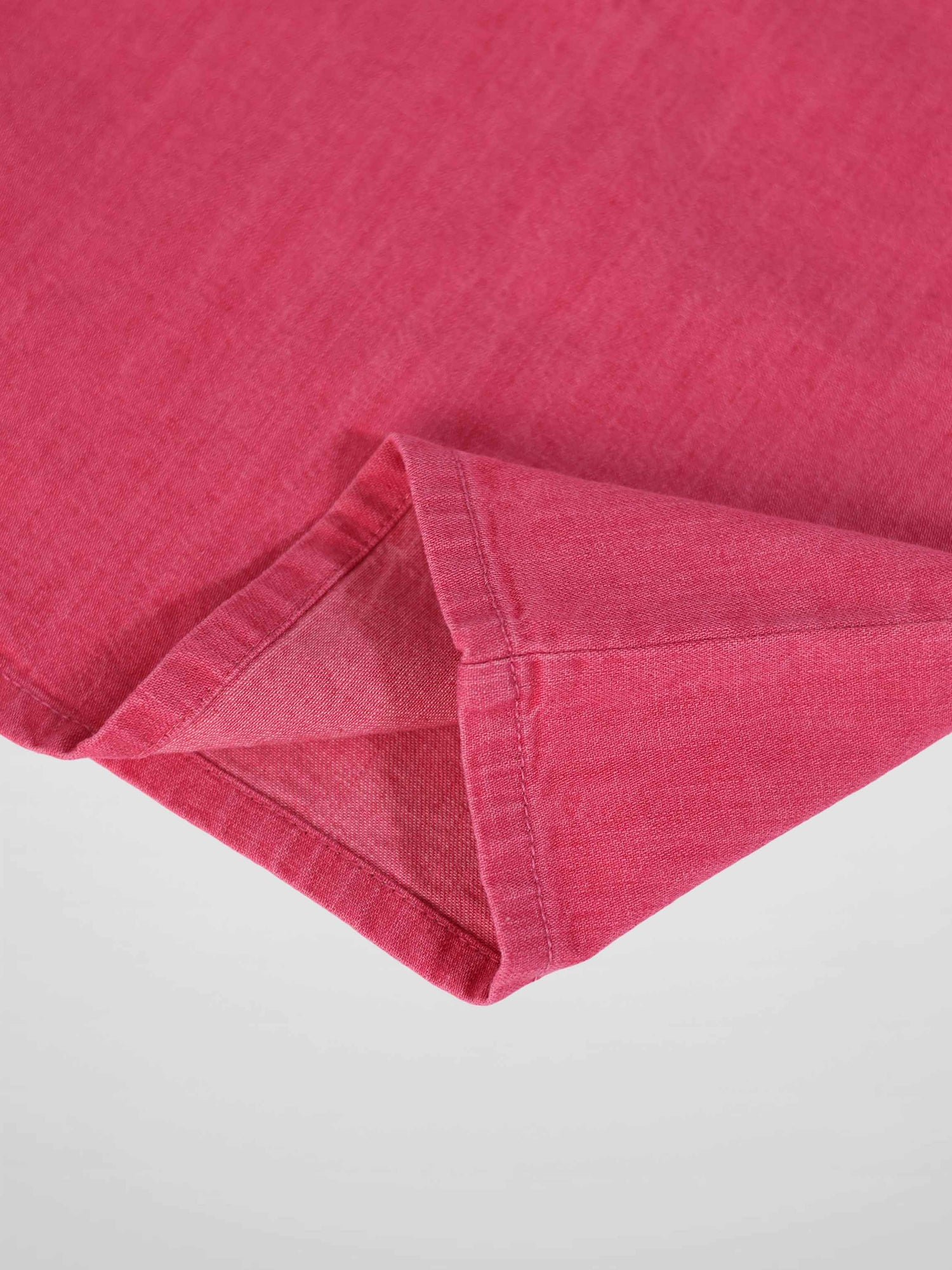 Short sleeve Henley top for girls in pink denim with visible seam.