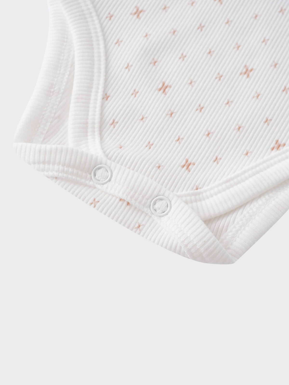 White baby bodysuit with snaps