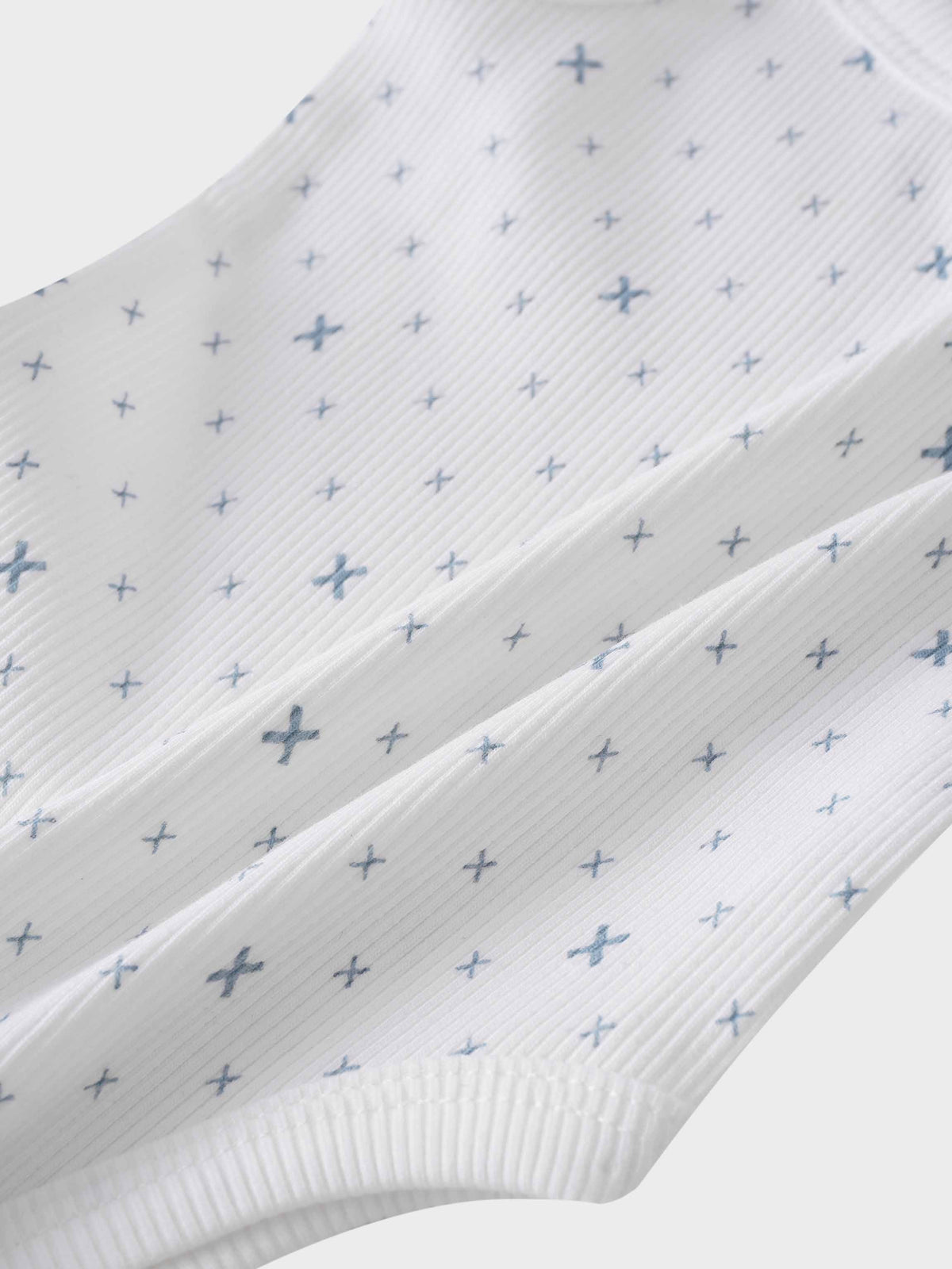Light blue diamond pattern bodysuit