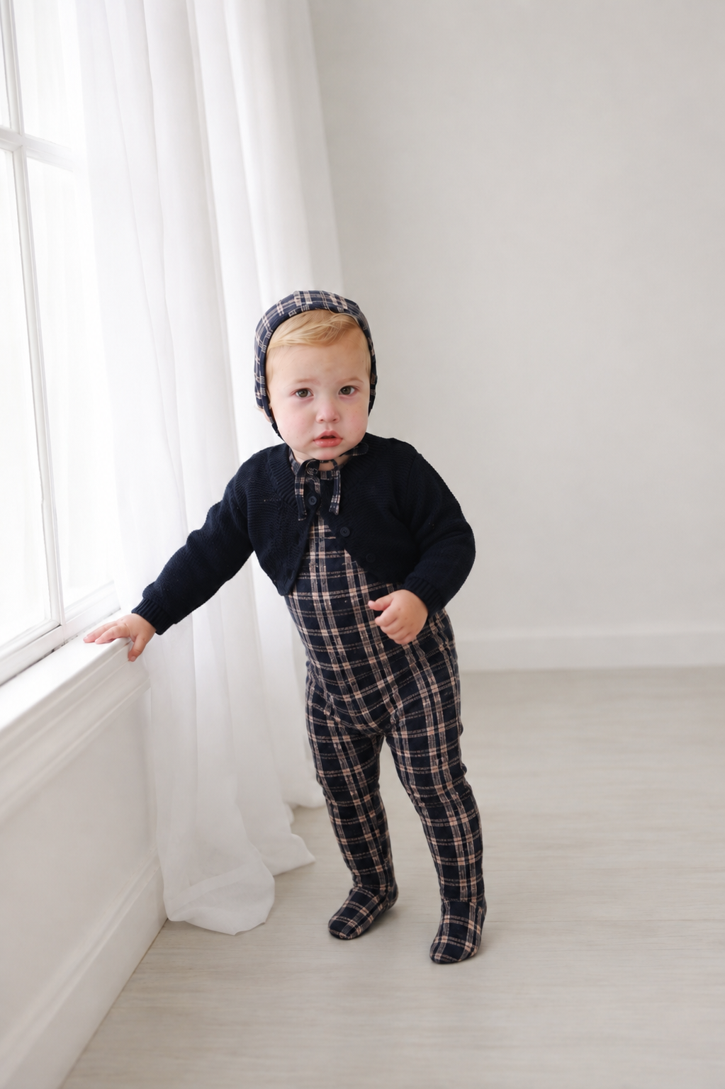 Cropped Cardigan - Navy on baby wearing navy plaid romper and matching bonnet (3-piece set)