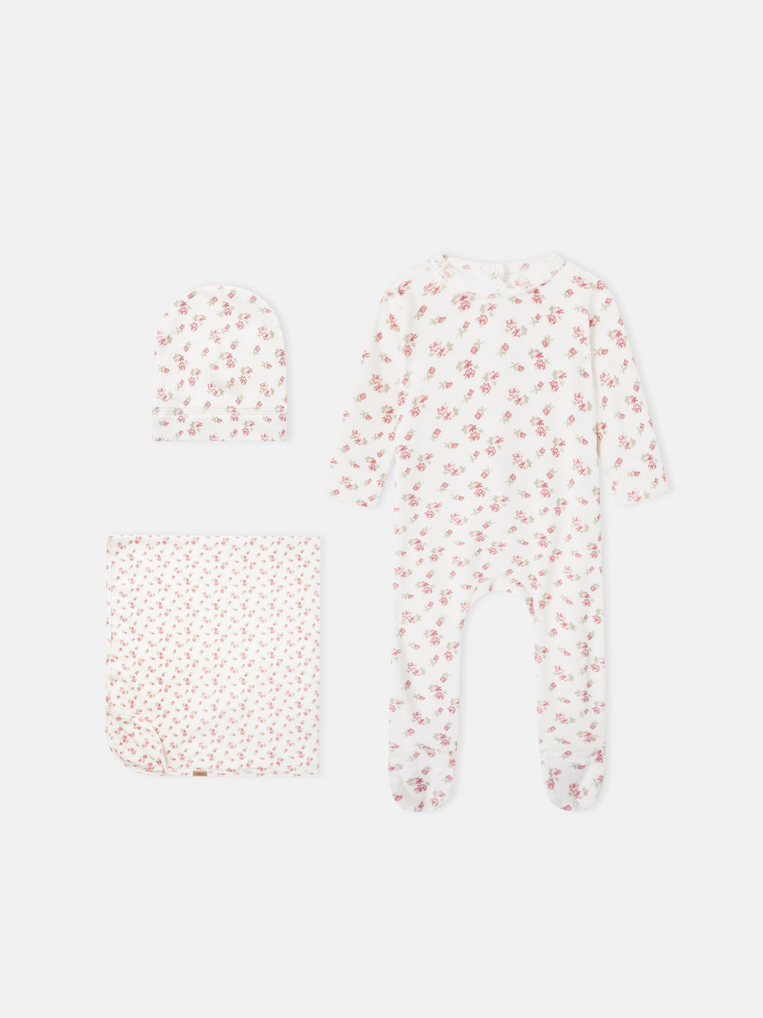 Adee Tiny Blossom layette set for baby girls; white fabric with pink florals; includes hat, blanket, and sleeper.