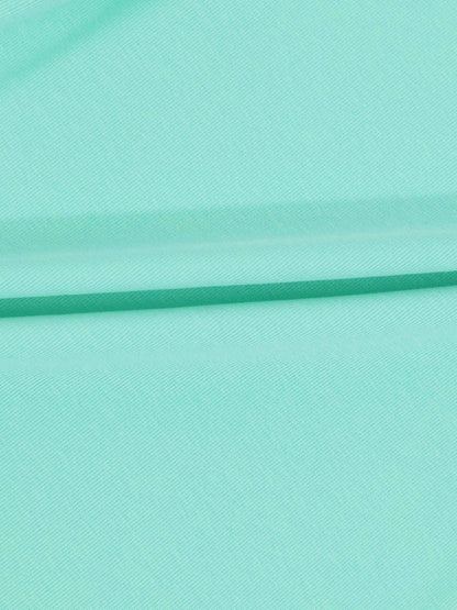 Mint green thin ribbed T-shirt fabric with soft folds.