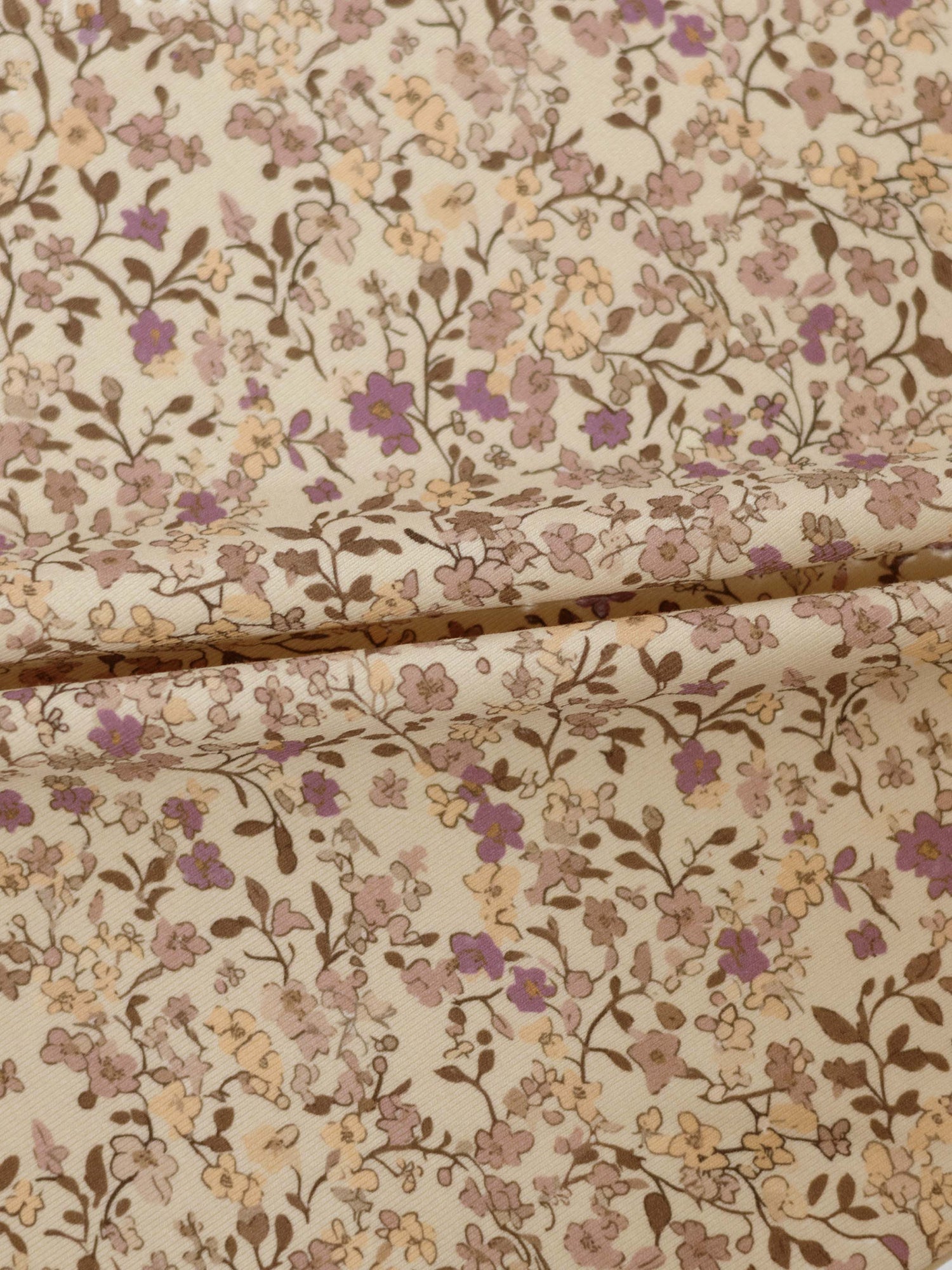 Purple Flower Skirt fabric with cream background and beige, lilac, peach floral pattern.