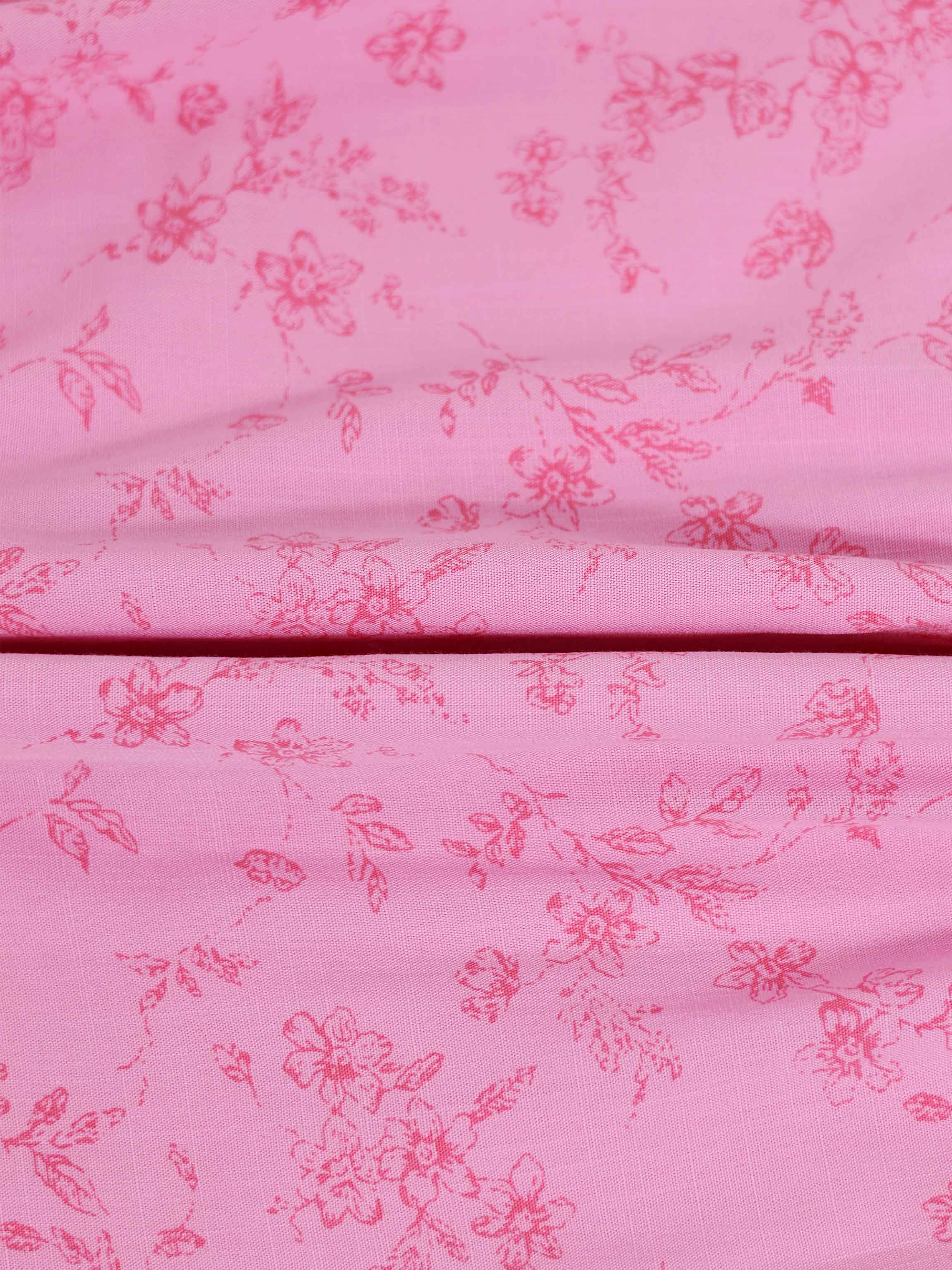 Pink flower print girls dressy romper; fabric close-up shows floral pattern