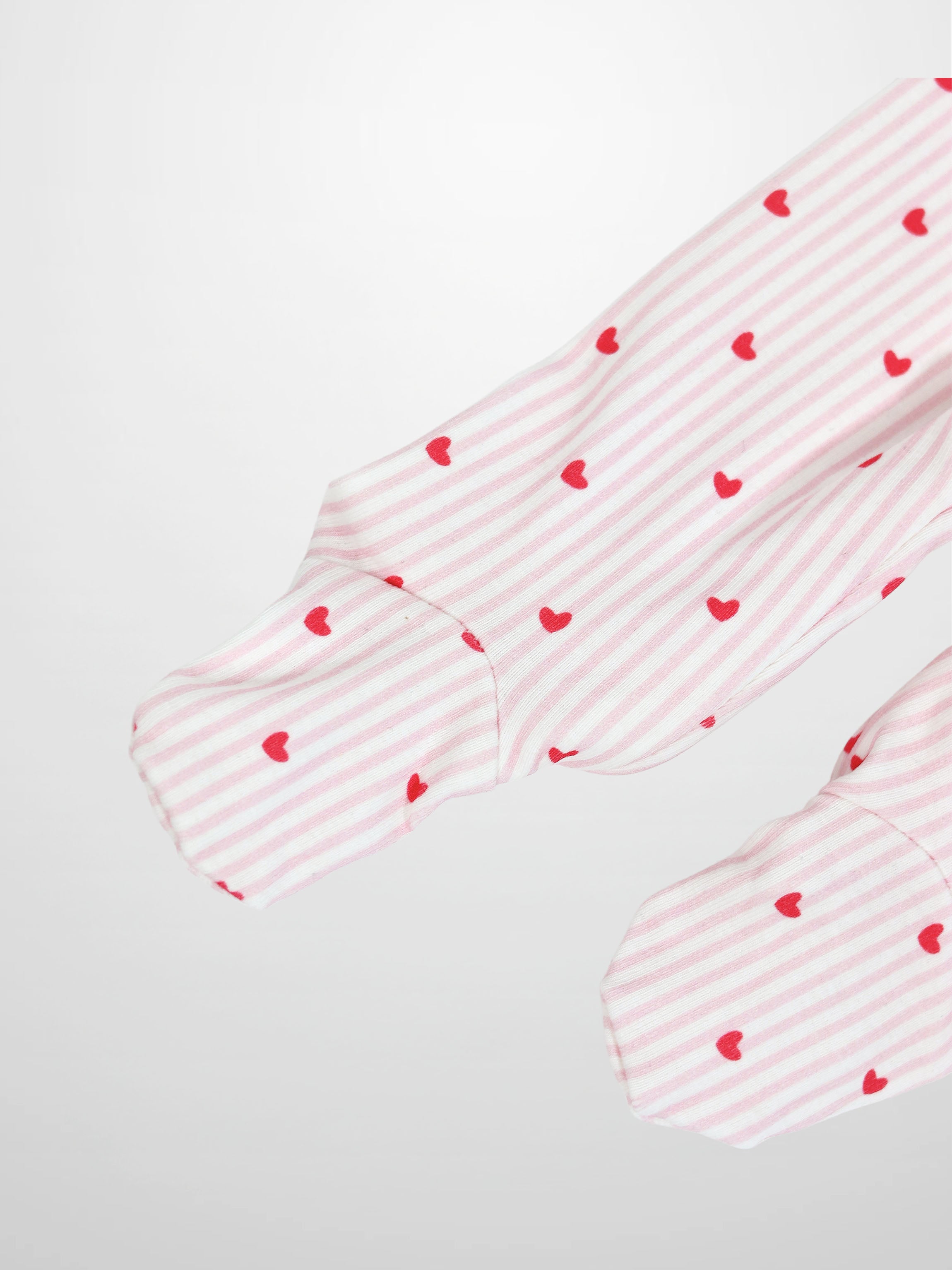 Pink Heart Stretchy with Lace: light pink and white stripes with hot-pink hearts on a baby jumpsuit sleeve