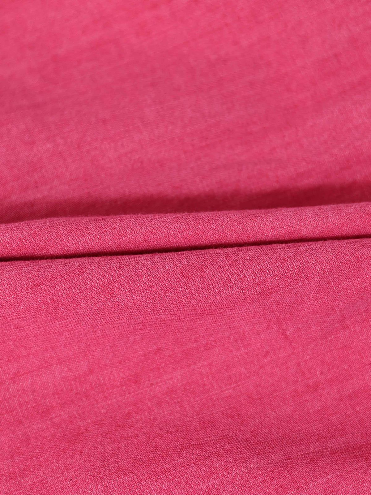 Pink denim fabric close-up with folded edge, for a 3/4 sleeve dress