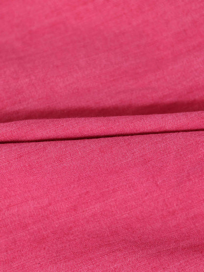 Pink denim fabric close-up with folded edge, for a 3/4 sleeve dress