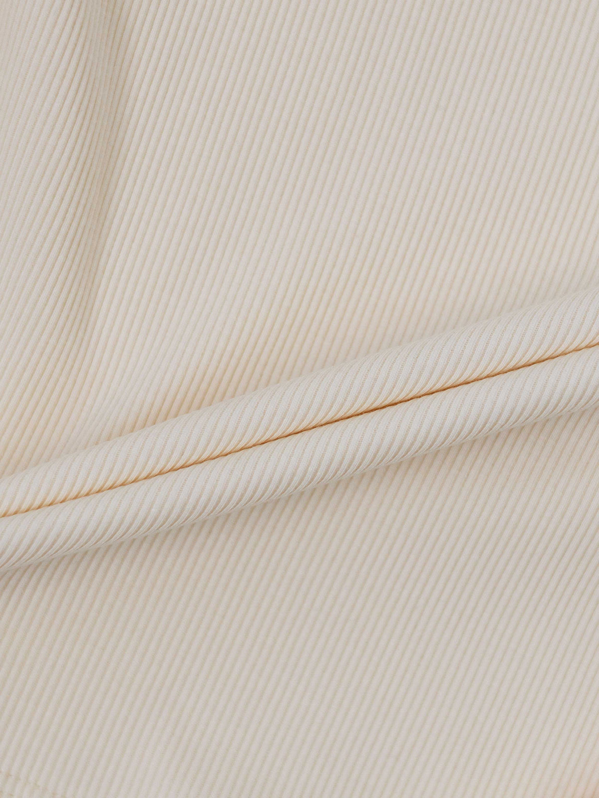 Ruffle Puff Sleeve Mock Neck Shirt Ivory by Adee, ribbed knit fabric close-up