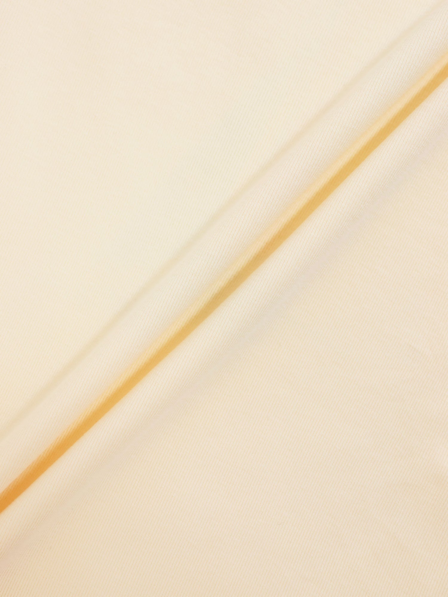 Golden Sail T-Shirt for boys, beige-gold fabric close-up with diagonal seam