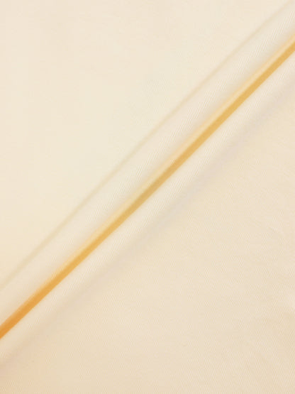 Golden Sail T-Shirt for boys, beige-gold fabric close-up with diagonal seam