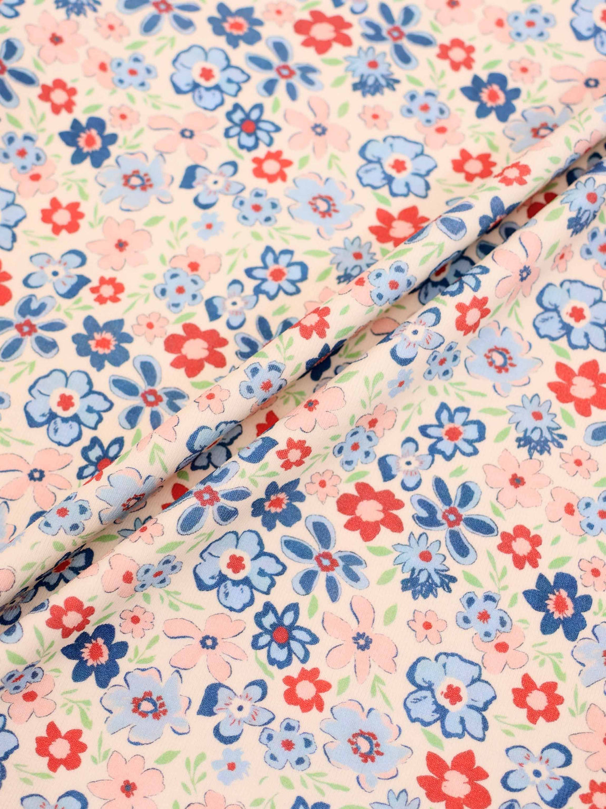 Garden Flower Short Sleeve Shirt for girls with pink, blue, and red floral print.