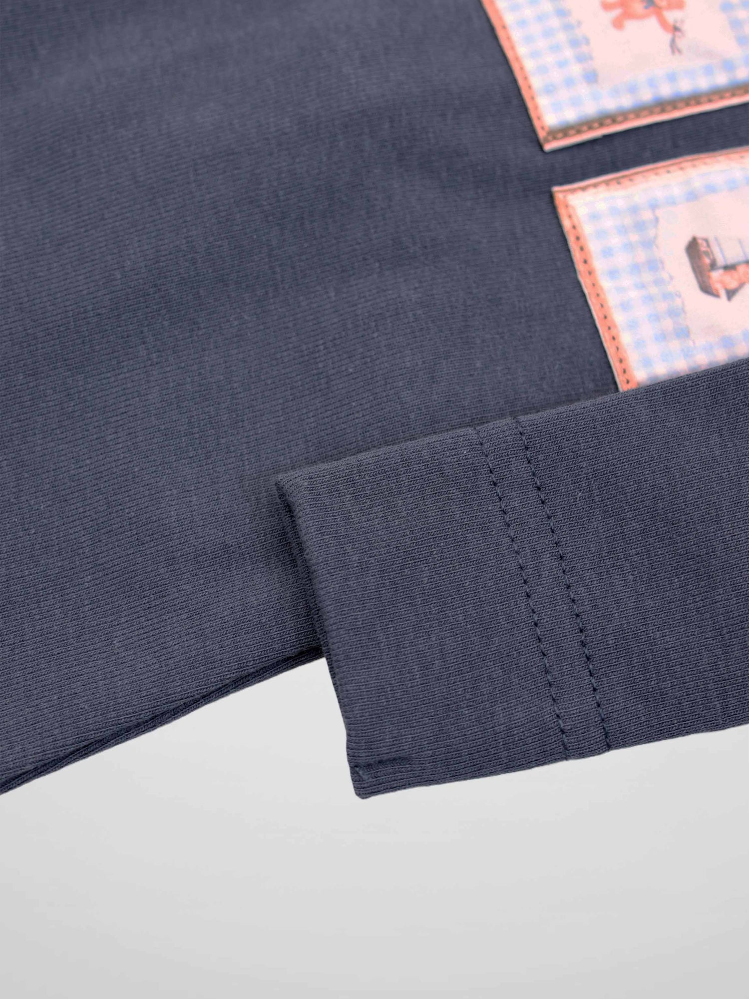 Teddy Frame Stretchy boys top in navy knit with pink-edged patch panels