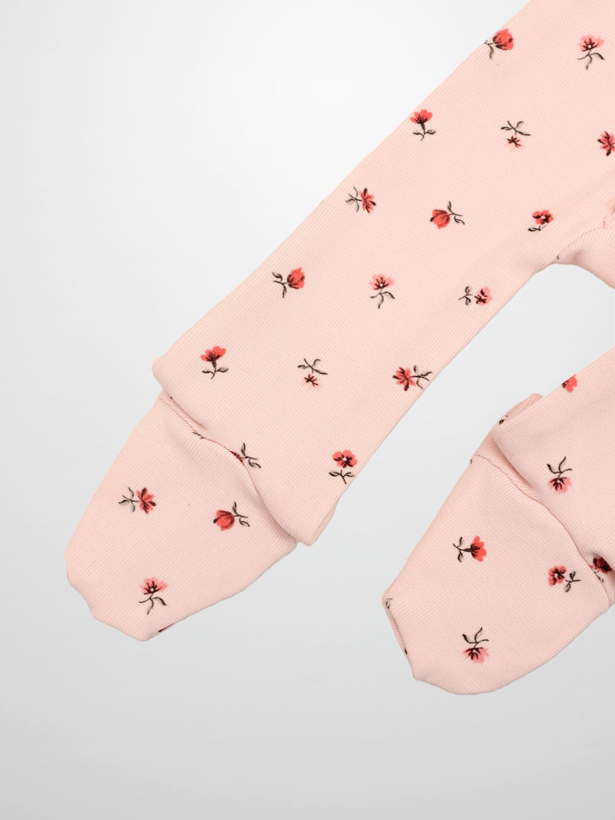 Adee Pink Petal Stretchy girls stretchies long-sleeve top with pale pink fabric and tiny red floral print
