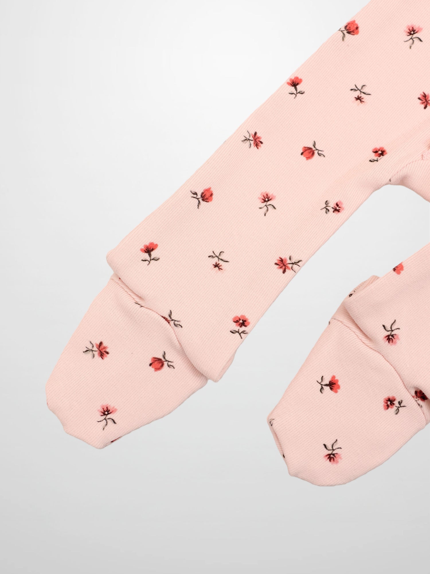 Adee Pink Petal Stretchy girls stretchies long-sleeve top with pale pink fabric and tiny red floral print