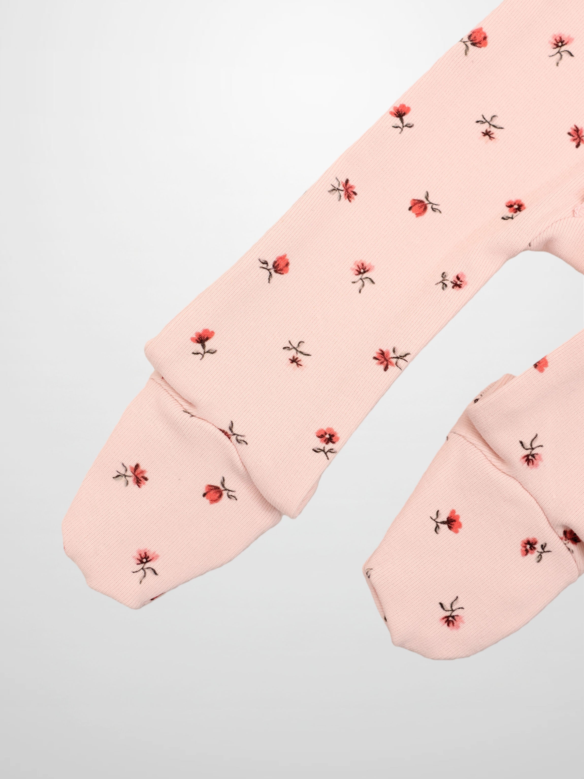 Adee Pink Petal Stretchy girls stretchies long-sleeve top with pale pink fabric and tiny red floral print