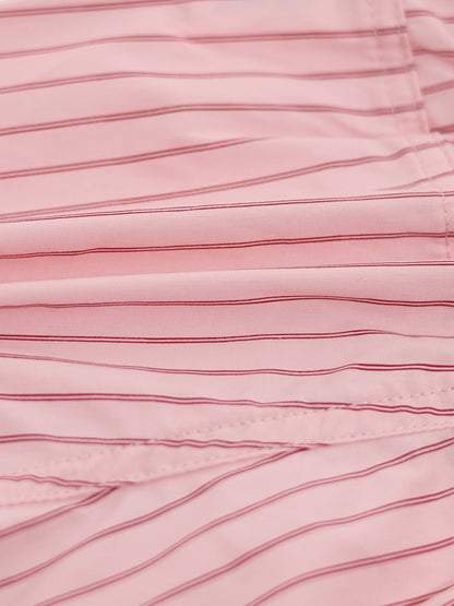 Striped pink cotton bloomers fabric close-up with thin red lines.