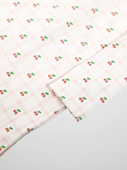 Cherry Window Stretchy; pink cherry-print fabric for Girls Stretchies.