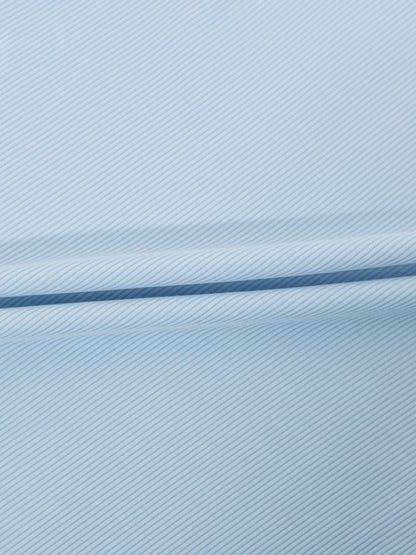 Light blue thin ribbed fabric for a T-shirt, folded to show texture.