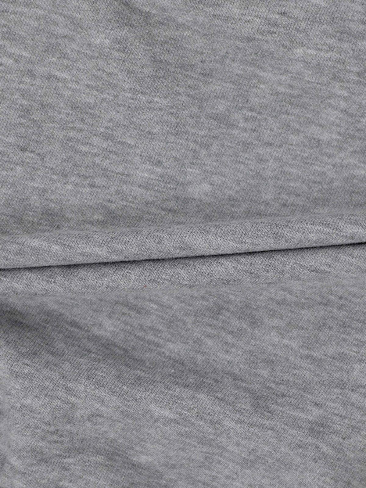 Close-up of grey sweatshirt fabric for Bike Sweatshirt - Grey, plush and warm, minimalist knit.