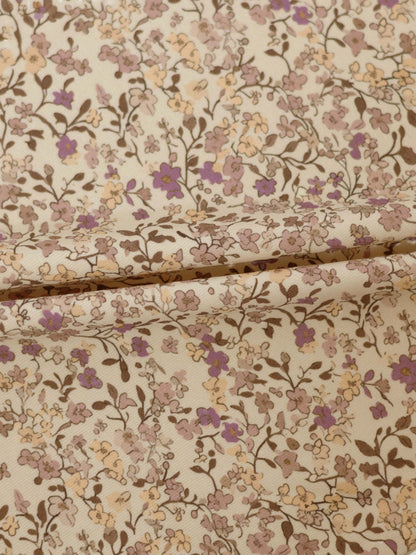Purple Flower Skirt fabric with beige base and pink and purple floral print.
