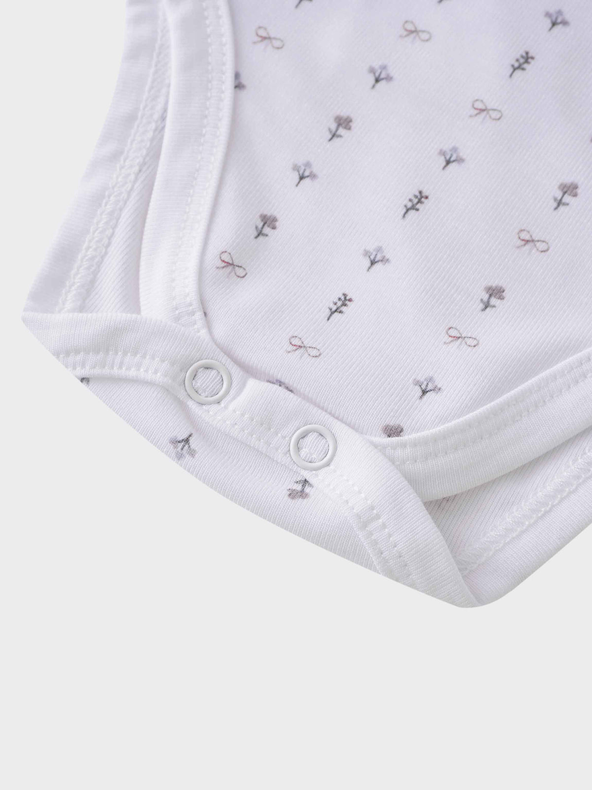 White bow print baby bodysuit