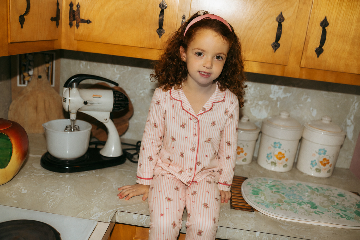 Girls Adee striped bear pajamas in red and pink with small bear prints.