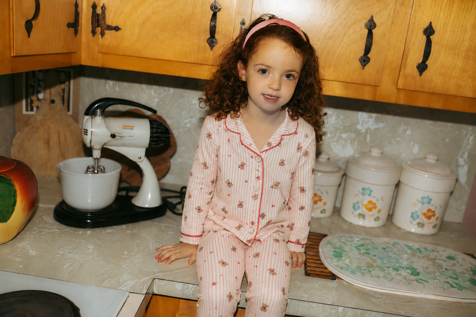 Girls Adee striped bear pajamas in red and pink with small bear prints.