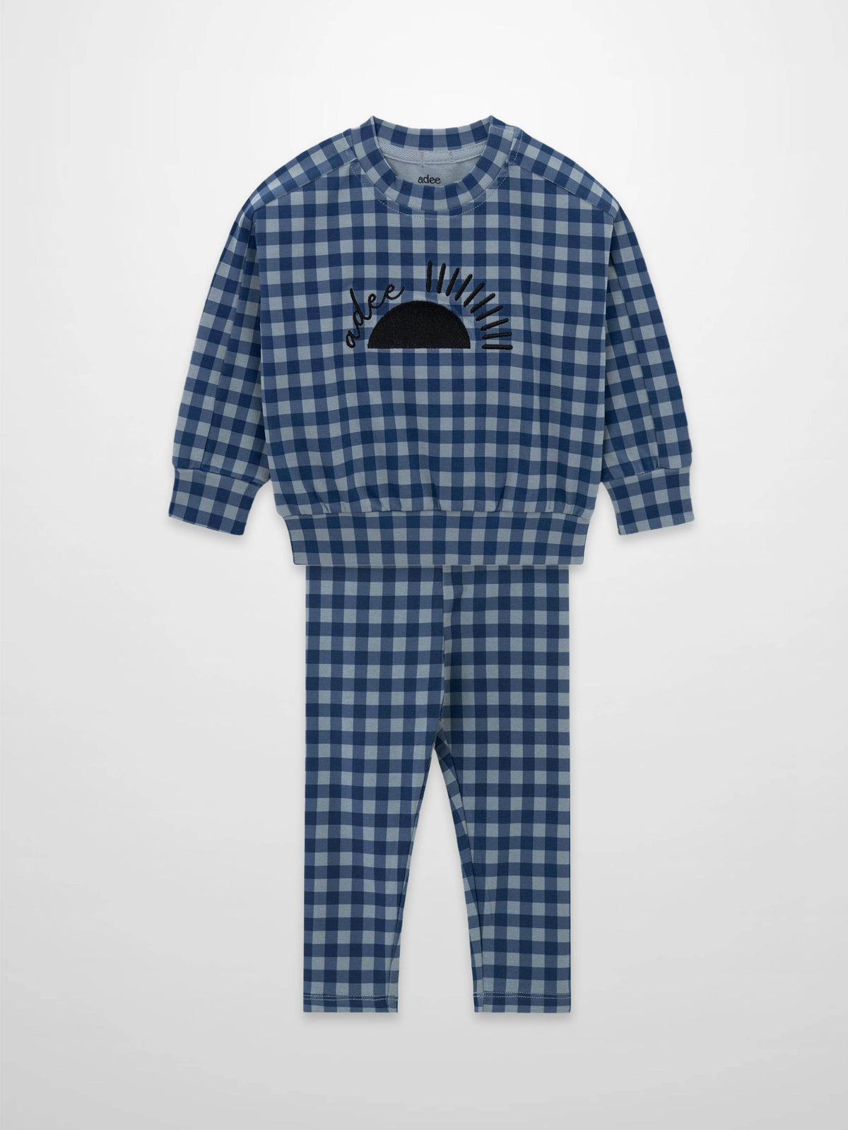 Blue gingham pajama set with long-sleeve top and matching pants, sun graphic on the chest.