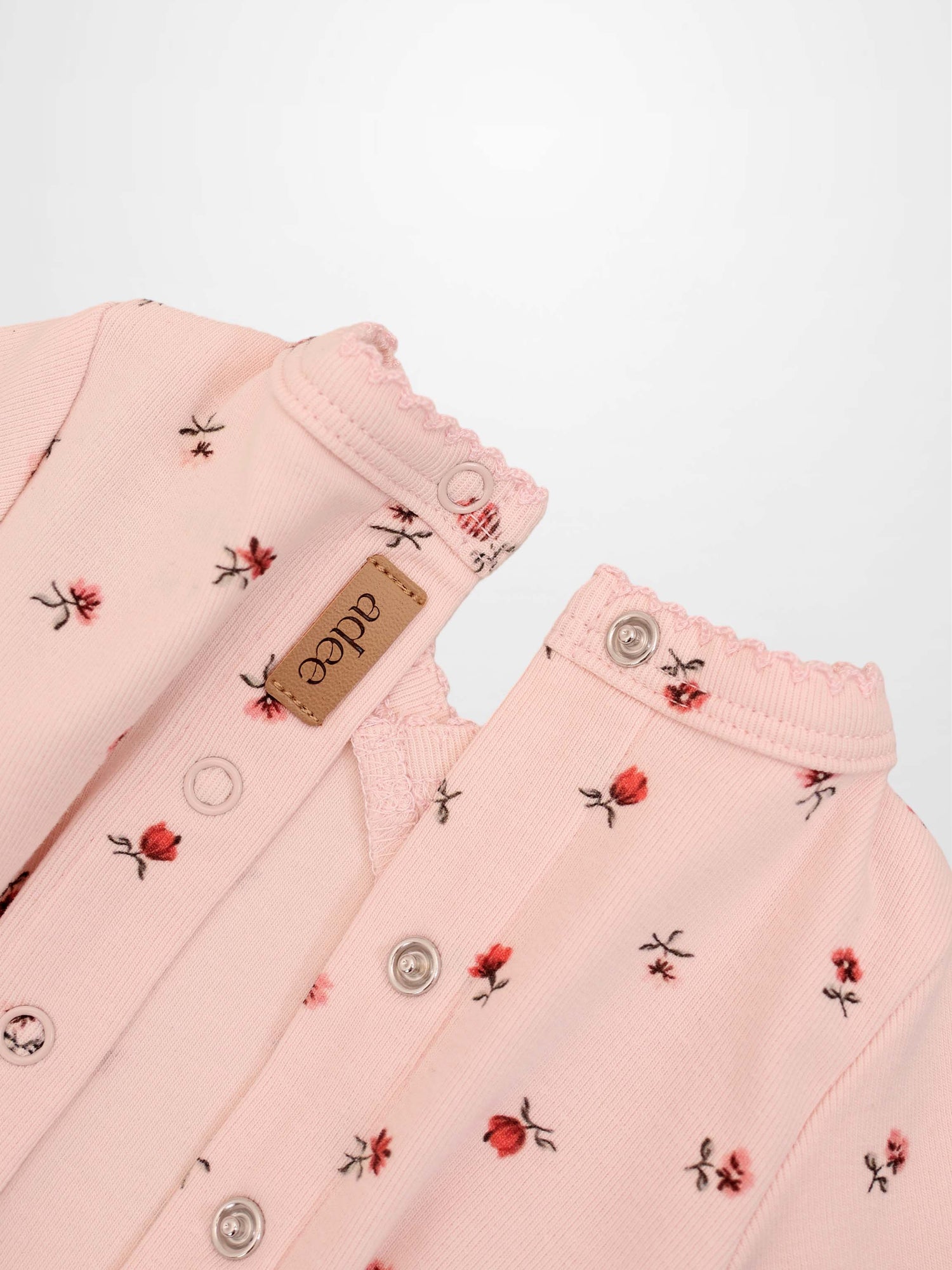Pink Petal Stretchy girls stretchies by Adee featuring red floral print, scalloped neckline and snap buttons.