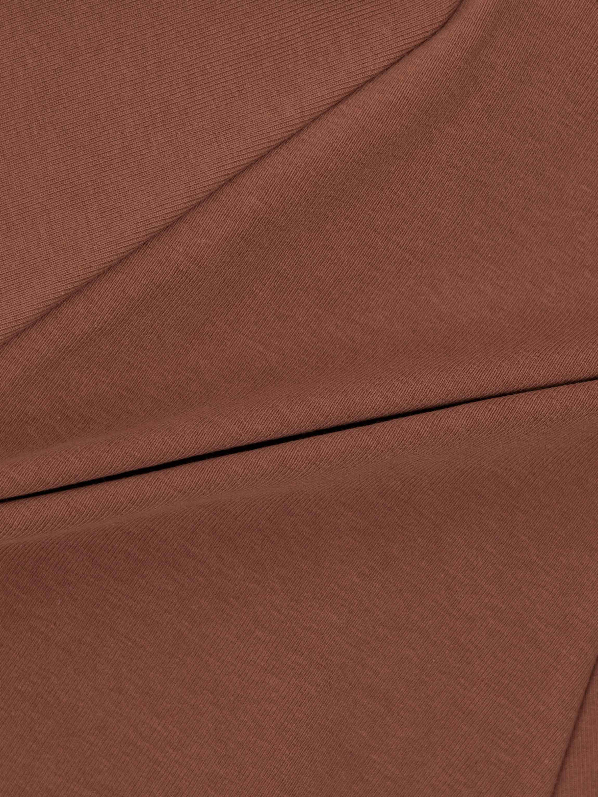 Dark mauve 6-panel skirt fabric close-up with visible seams.