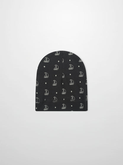 Harbor Dot Hat by Adee; navy blue boys beanie featuring white sailboats and small dot repeating pattern