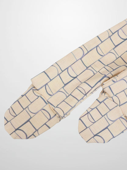 Geometric Crossover Stretchy baby boy jumpsuit footie in light beige with pale blue rounded-rectangle and arch pattern