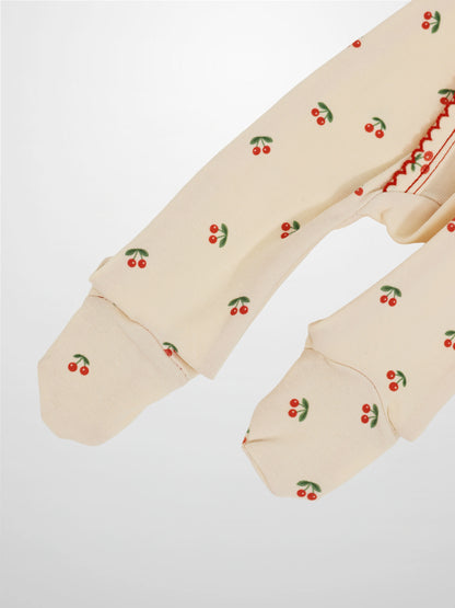 Red Cherry Stretchy girls stretchies by Adee; beige knit fabric with red cherries on green stems