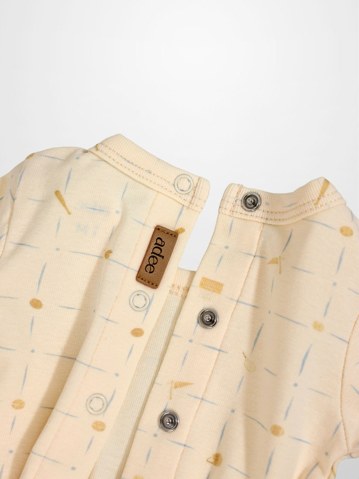 Grand Slam Stretchy boys stretchies in pale cream with thin blue strokes; Adee brand with metal snaps.