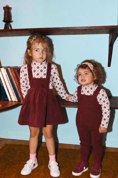 Mosaic Floral Mock Neck T-Shirt; two girls in burgundy outfits with white patterned tops.