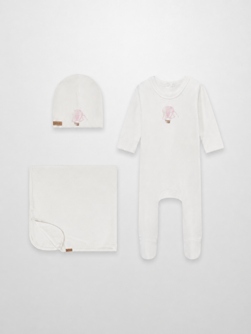 Pink Balloon three-piece layette set by Adee: white hat, blanket, and footed sleepsuit with pink balloon motif.