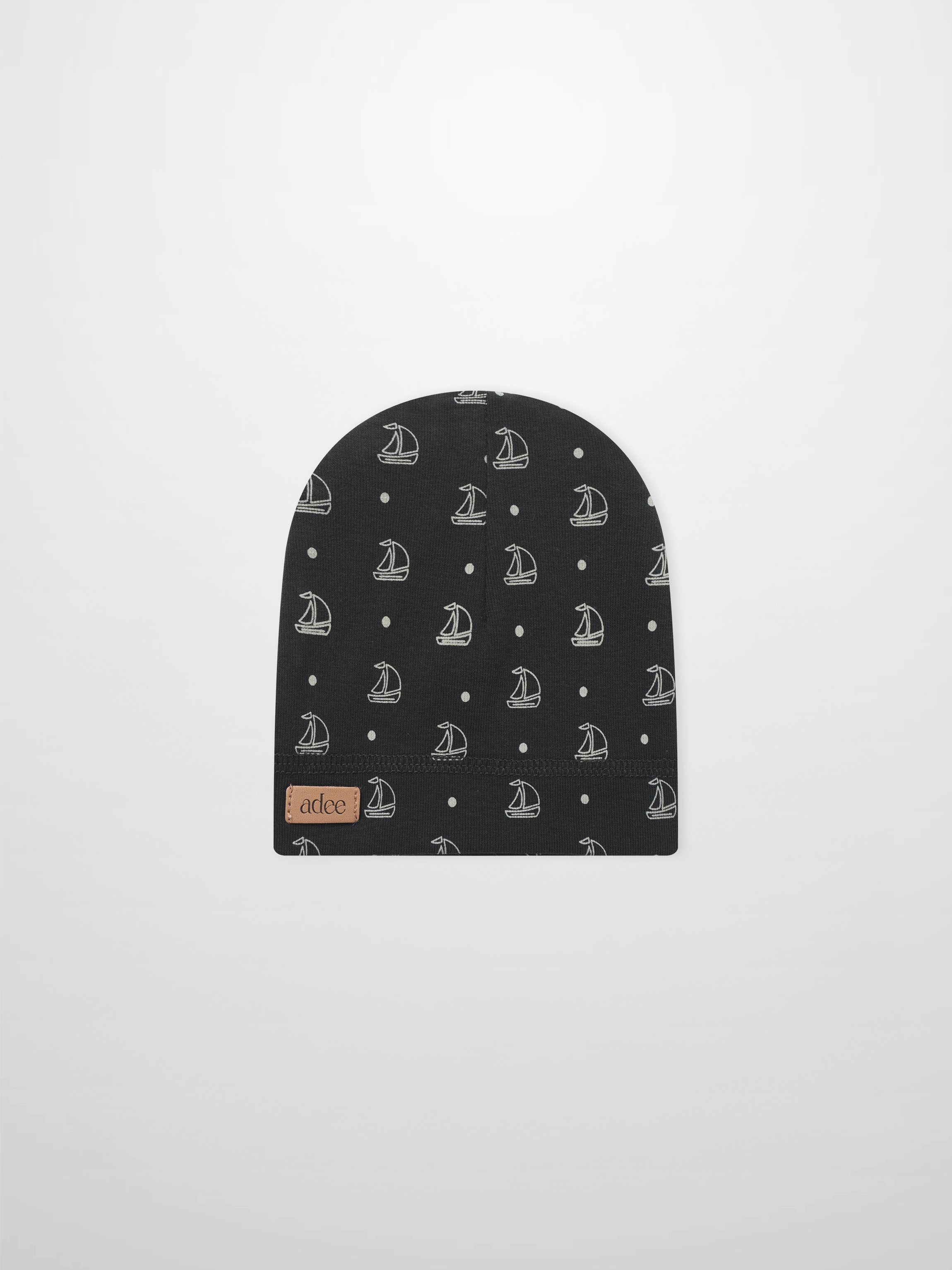 Harbor Dot Hat, navy beanie with white sailboat pattern, Adee brand.