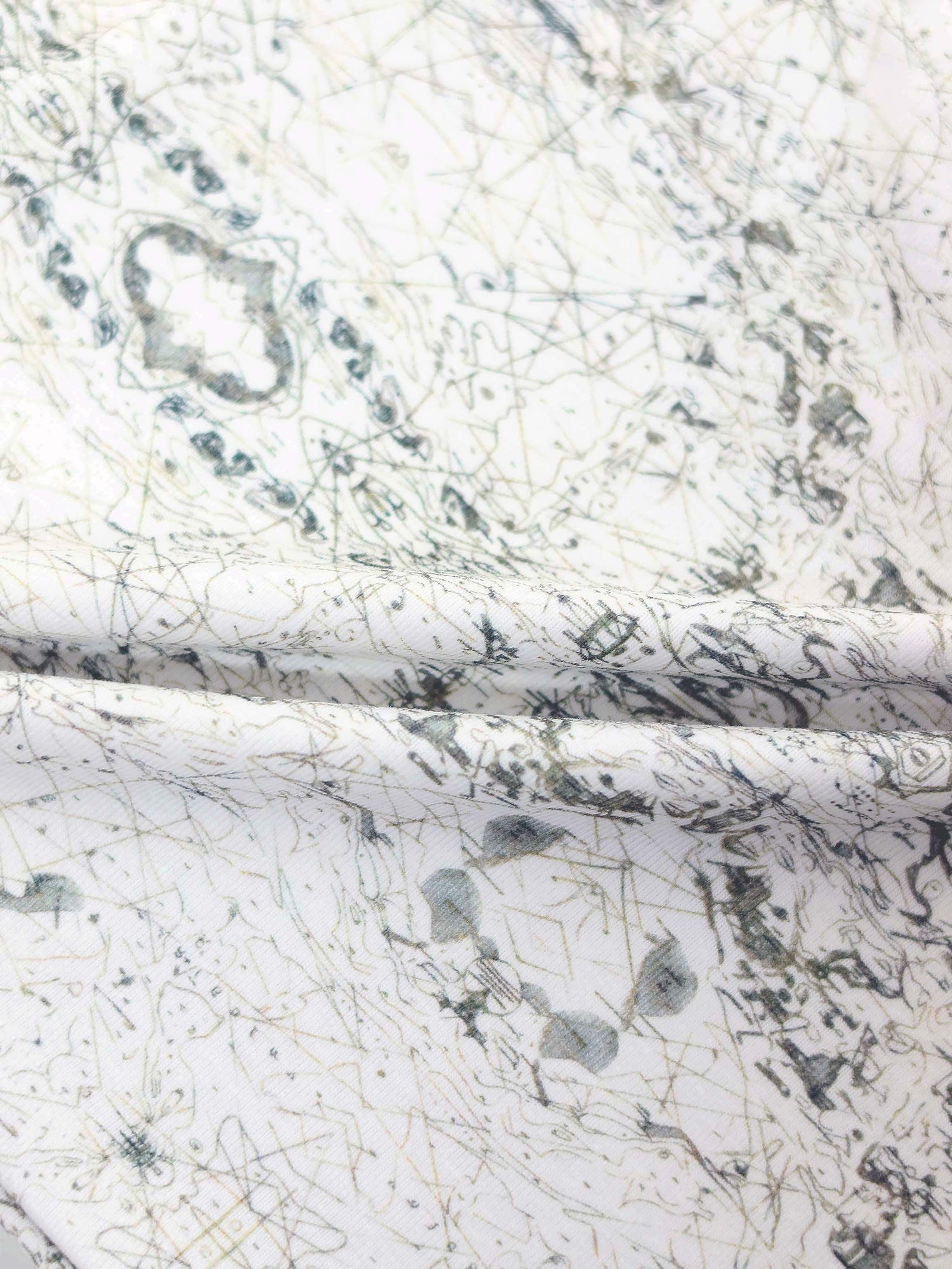 Map Stretchy jumpsuit footie fabric: off-white with sage-green map lines and compass markers