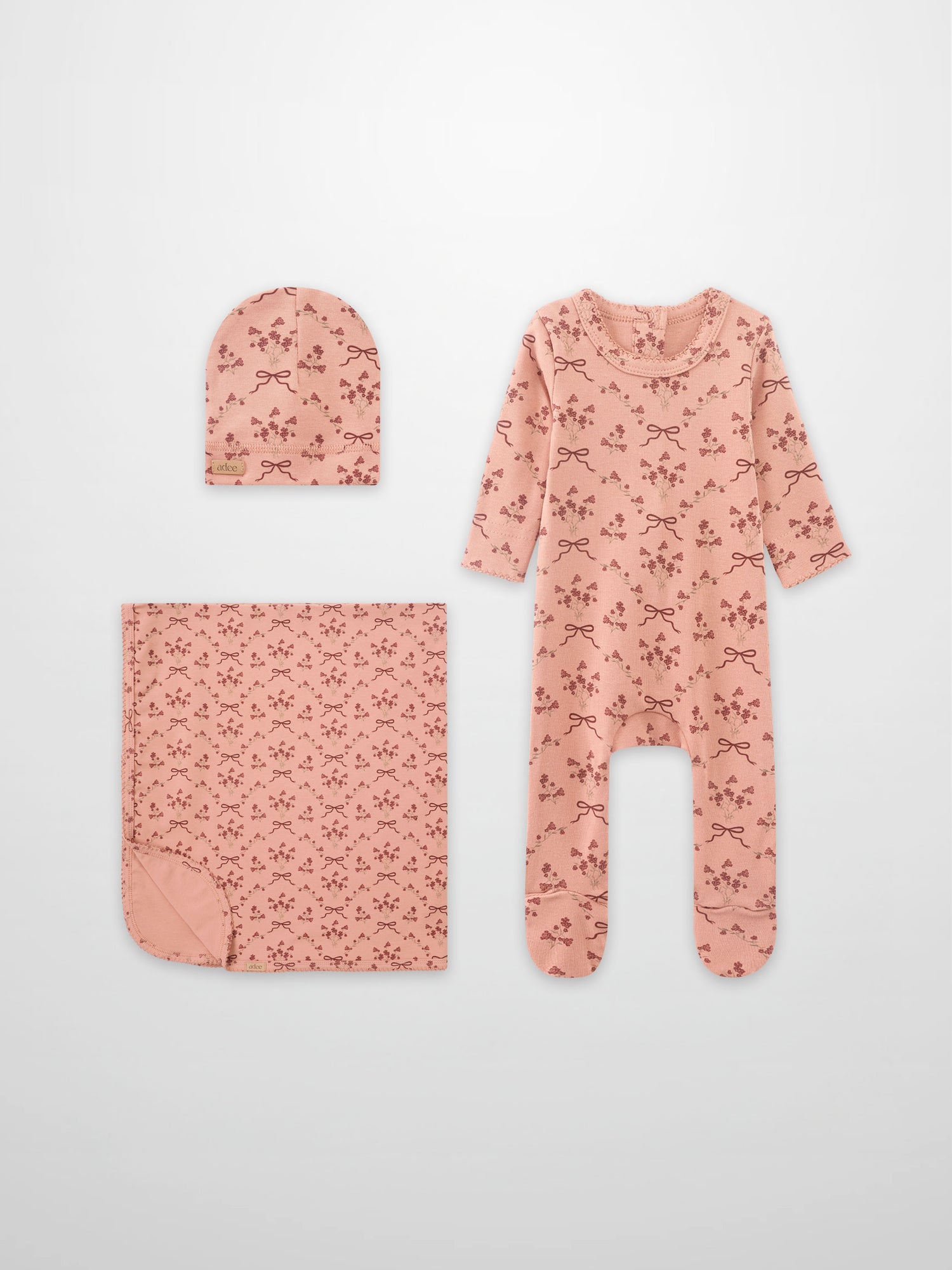 Bow Bouquet girls layette set by Adee in pink with floral bows; includes hat, blanket, romper.